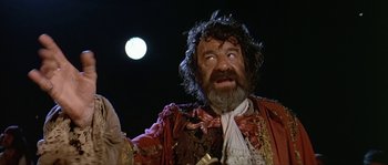 Movie still from “Pirates” (1986), directed by Roman Polanski – A person wearing a costume; Medium shot, Low angle