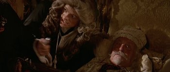 Movie still from “Pirates” (1986), directed by Roman Polanski – A man and a woman dressed in period clothing; Medium shot, High angle