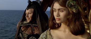 Movie still from “Pirates” (1986), directed by Roman Polanski – Two women dressed in renaissance clothing looking at each other; Close Up shot, Over the shoulder angle