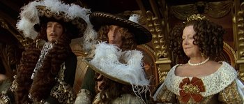 Movie still from “Pirates” (1986), directed by Roman Polanski – A man with a hat and a long curly hair; Medium shot, Low angle