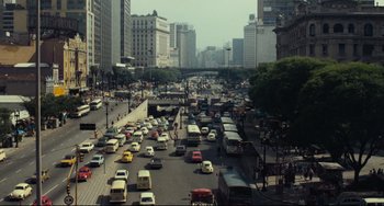 Movie still from “Pixote” (1980), directed by Hector Babenco – A busy city street filled with lots of traffic; Extreme Wide shot, High angle