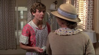 Movie still from “Places in the Heart” (1984), directed by Robert Benton – A woman talking to another woman in a room; Medium shot, Over the shoulder angle