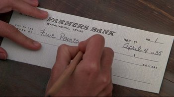Movie still from “Places in the Heart” (1984), directed by Robert Benton – A person writing on a check with a pencil; Extreme Close Up shot, Overhead angle