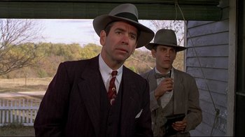 Movie still from “Places in the Heart” (1984), directed by Robert Benton – A man in a suit and a man in a hat; Close Up shot, Low angle