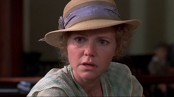 Movie still from “Places in the Heart” (1984), directed by Robert Benton – A person wearing a hat; Close Up shot, Over the shoulder angle