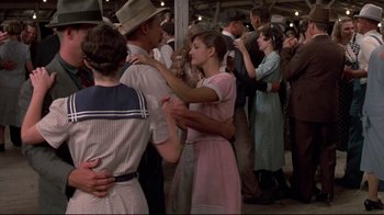 Movie still from “Places in the Heart” (1984), directed by Robert Benton – A group of young people dancing in a crowd; Wide shot, High angle
