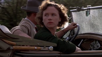 Movie still from “Places in the Heart” (1984), directed by Robert Benton – A woman sitting in the driver's seat of a car; Close Up shot, Low angle