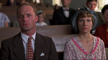 Movie still from “Places in the Heart” (1984), directed by Robert Benton – A man and a woman sitting next to each other; Close Up shot, Low angle