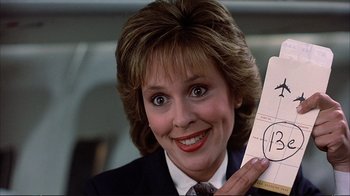 Movie still from “Planes, Trains & Automobiles” (1987), directed by John Hughes – A person holding up a paper; Close Up shot, Overhead angle