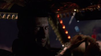 Movie still from “Planes, Trains & Automobiles” (1987), directed by John Hughes – A man's face in the dark; Close Up shot, Low angle