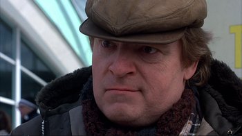 Movie still from “Planes, Trains & Automobiles” (1987), directed by John Hughes – A person wearing a hat; Close Up shot, Low angle