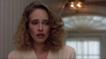 Movie still from “Planes, Trains & Automobiles” (1987), directed by John Hughes – A person with curly hair; Close Up shot, Over the shoulder angle