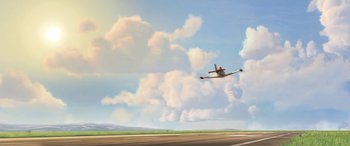 Movie still from “Planes: Fire & Rescue” (2014), directed by Bobs Gannaway – An airplane is flying in the sky on a cloudy day; Extreme Wide shot, Low angle