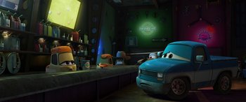 Movie still from “Planes: Fire & Rescue” (2014), directed by Bobs Gannaway – A blue car is in a room with a lot of toys on the floor; Wide shot, High angle