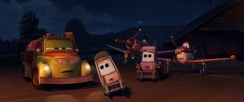 Movie still from “Planes: Fire & Rescue” (2014), directed by Bobs Gannaway – A group of toy cars in a field at night time; Extreme Wide shot, Low angle