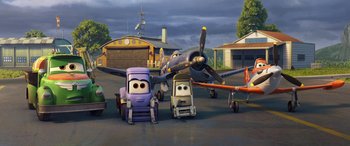 Movie still from “Planes: Fire & Rescue” (2014), directed by Bobs Gannaway – A group of cartoon characters in front of an airplane; Extreme Wide shot, Low angle