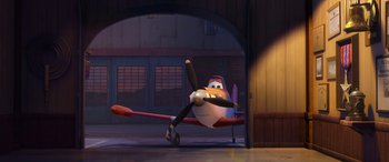 Movie still from “Planes: Fire & Rescue” (2014), directed by Bobs Gannaway – An airplane is sitting in the middle of a hangar; Wide shot, Low angle