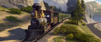 Movie still from “Planes: Fire & Rescue” (2014), directed by Bobs Gannaway – A train is traveling down the tracks near a wooded area; Wide shot, High angle