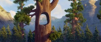 Movie still from “Planes: Fire & Rescue” (2014), directed by Bobs Gannaway – A tree with a hole in the middle of it's trunk; Extreme Wide shot, Low angle