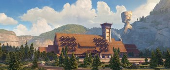 Movie still from “Planes: Fire & Rescue” (2014), directed by Bobs Gannaway – An illustration of a building with trees in front of it; Extreme Wide shot, High angle