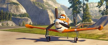 Movie still from “Planes: Fire & Rescue” (2014), directed by Bobs Gannaway – An airplane with a propeller sitting on top of a runway; Wide shot, Low angle
