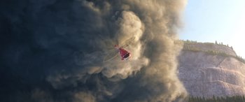 Movie still from “Planes: Fire & Rescue” (2014), directed by Bobs Gannaway – A helicopter is flying through a cloud filled sky; Extreme Wide shot, Overhead angle