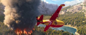 Movie still from “Planes: Fire & Rescue” (2014), directed by Bobs Gannaway – A red and yellow airplane flying over a forest; Extreme Wide shot, Low angle