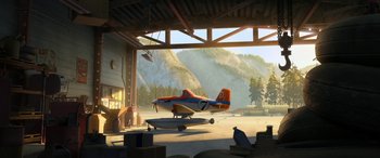 Movie still from “Planes: Fire & Rescue” (2014), directed by Bobs Gannaway – An orange and blue airplane sitting on top of an airport runway; Extreme Wide shot, Low angle
