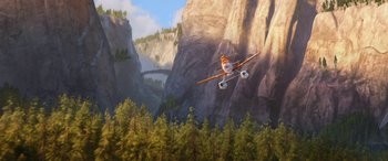 Movie still from “Planes: Fire & Rescue” (2014), directed by Bobs Gannaway – An airplane flying through the air over a forest; Extreme Wide shot, Low angle