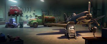 Movie still from “Planes: Fire & Rescue” (2014), directed by Bobs Gannaway – A green truck is parked next to an airplane in a garage; Wide shot, Low angle