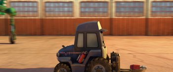 Movie still from “Planes: Fire & Rescue” (2014), directed by Bobs Gannaway – A toy truck is driving down the street; Wide shot, High angle