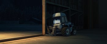 Movie still from “Planes: Fire & Rescue” (2014), directed by Bobs Gannaway – A truck that is sitting in the middle of the road; Wide shot, High angle