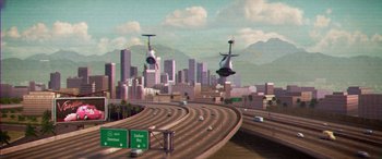 Movie still from “Planes: Fire & Rescue” (2014), directed by Bobs Gannaway – An image of an airplane flying over a freeway; Extreme Wide shot, Low angle