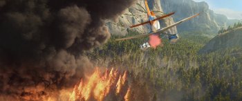 Movie still from “Planes: Fire & Rescue” (2014), directed by Bobs Gannaway – A helicopter flying over a forest with a lot of smoke coming out of it; Extreme Wide shot, Overhead angle