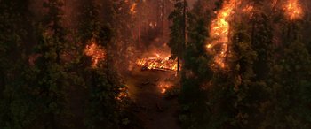 Movie still from “Planes: Fire & Rescue” (2014), directed by Bobs Gannaway – A forest is on fire with trees in the background; Extreme Wide shot, High angle