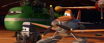 Movie still from “Planes: Fire & Rescue” (2014), directed by Bobs Gannaway – An airplane with a propeller sitting on top of a wooden floor; Wide shot, Low angle