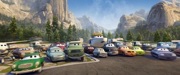 Movie still from “Planes: Fire & Rescue” (2014), directed by Bobs Gannaway – A bunch of cars that are in a parking lot; Extreme Wide shot, High angle