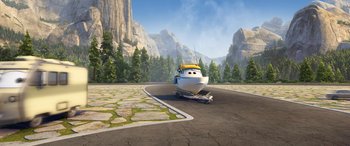 Movie still from “Planes: Fire & Rescue” (2014), directed by Bobs Gannaway – A boat on a skateboard on a paved road; Extreme Wide shot, High angle