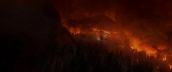 Movie still from “Planes: Fire & Rescue” (2014), directed by Bobs Gannaway – An airplane is flying through the sky at night; Extreme Wide shot, High angle