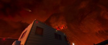 Movie still from “Planes: Fire & Rescue” (2014), directed by Bobs Gannaway – A camper is in the middle of a fire; Extreme Wide shot, Low angle
