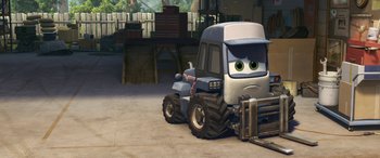 Movie still from “Planes: Fire & Rescue” (2014), directed by Bobs Gannaway – A cartoon truck with eyes on it is parked in a parking lot; Wide shot, High angle