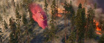 Movie still from “Planes: Fire & Rescue” (2014), directed by Bobs Gannaway – An aerial view of a helicopter flying over a forest fire; Extreme Wide shot, Overhead angle