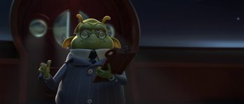 Movie still from “Planet 51” (2009), directed by Javier Abad – A cartoon character in a business suit holding a book; Medium shot, Over the shoulder angle