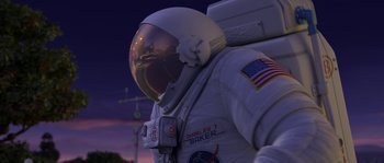 Movie still from “Planet 51” (2009), directed by Javier Abad – A person wearing a space suit; Wide shot, Low angle
