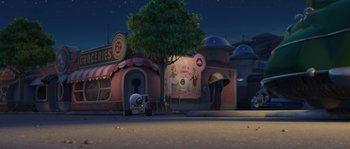 Movie still from “Planet 51” (2009), directed by Javier Abad – An image of an animated scene with a building in the background; Extreme Wide shot, High angle