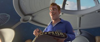 Movie still from “Planet 51” (2009), directed by Javier Abad – An animated man holding a skateboard in his hand; Medium shot, High angle