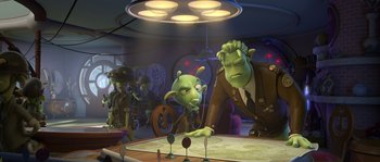 Movie still from “Planet 51” (2009), directed by Javier Abad – A group of people standing next to each other in a room; Medium shot, Over the shoulder angle