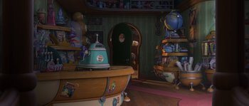 Movie still from “Planet 51” (2009), directed by Javier Abad – An amusement ride is shown in a room with a lot of toys; Extreme Wide shot, High angle