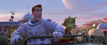 Movie still from “Planet 51” (2009), directed by Javier Abad – A man in a space suit next to an alien; Medium shot, Over the shoulder angle