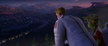 Movie still from “Planet 51” (2009), directed by Javier Abad – A man looking out over a valley at night; Wide shot, High angle